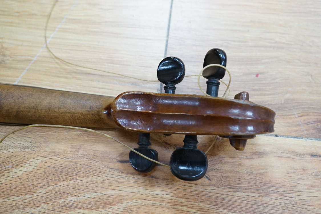 A quarter-size German violin, back measures 31cm. Condition - fair